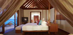 Anantara Resort & Spa Maldives - Sunset-Over-Water-Suite-Bedroom.jpg